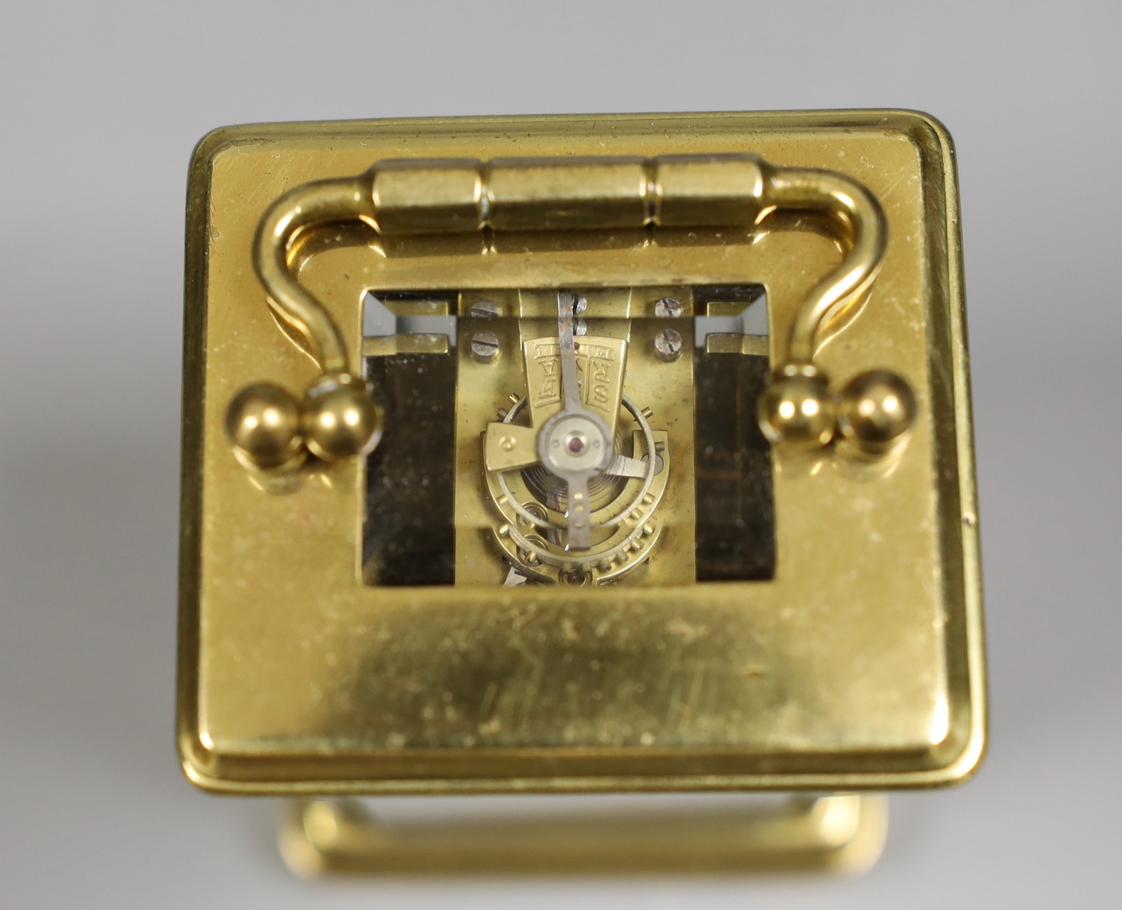 A miniature carriage timepiece, with enamelled side panels of Venice, 8 cms high